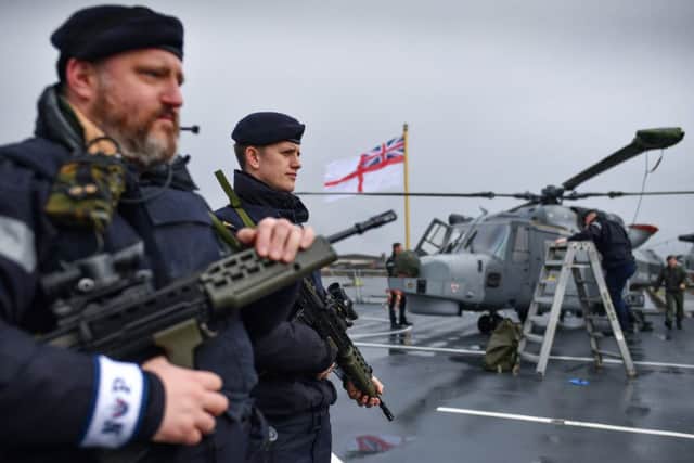 Crew members on board HMS Defender as it is docked on March 22, 2019 in Glasgow, Scotland. (Photo by Jeff J Mitchell/Getty Images)