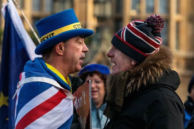 Anti-Brexit protester and a pro-Brexit protester argue. (Photo by Jack Taylor/Getty Images)