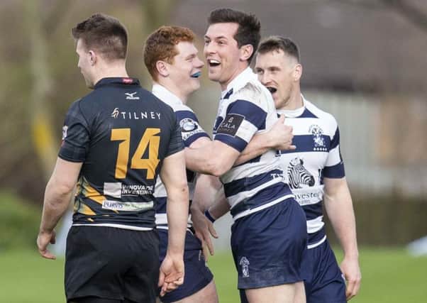 Charlie Simpson celebrates his try for Heriot's against Currie. Picture: SNS
