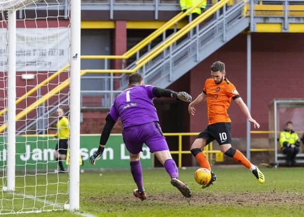 Nicky Clark scores 
Dundee United's late winner. Picture: Roddy Scott/SNS