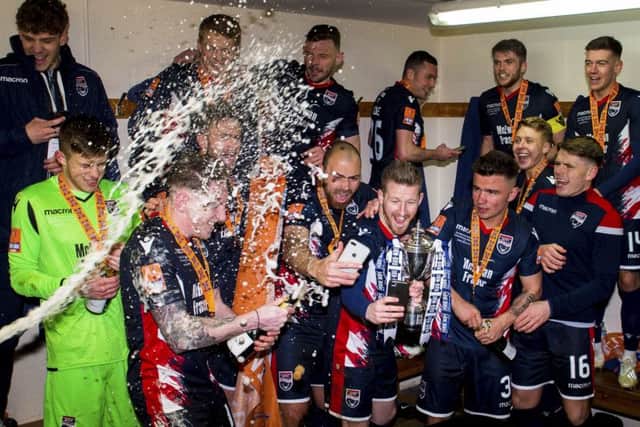 Ross County celebrate in the dressing room at full-time. Picture: SNS