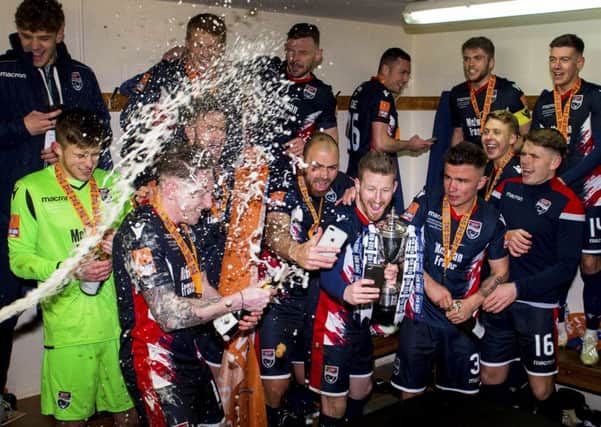 Ross County celebrate in the dressing room at full-time. Picture: SNS