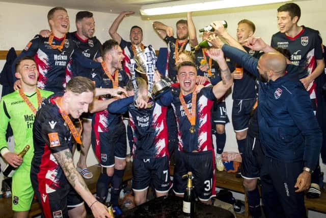 Ross County players enjoy their triumph in the dressing room following their Irn-Bru Cup final victory over Connahs Quay Nomads. Picture: SNS.