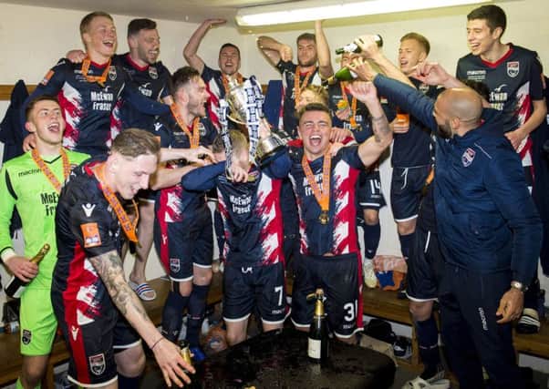 Ross County players enjoy their triumph in the dressing room following their Irn-Bru Cup final victory over Connahs Quay Nomads. Picture: SNS.