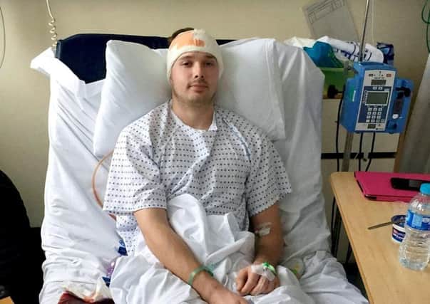 Craig Telfer, 27, in hospital following his operation at Glasgow's Queen Elizabeth University Hospital. Picture: SWNS