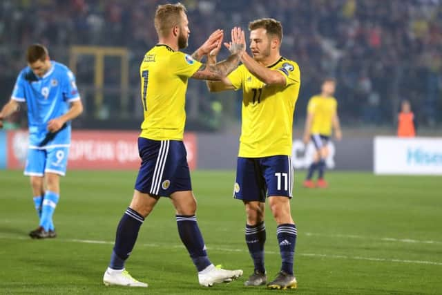 Scotland's Johnny Russell celebrates scoring his side's second goal. Pic: Simon Cooper/PA