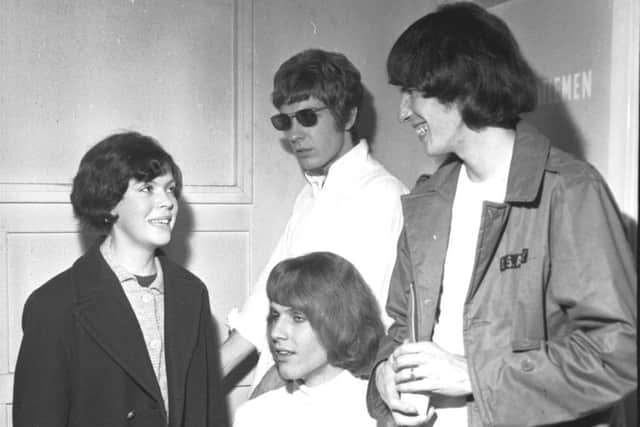 A fan gets to meet the Walker Brothers at their concert in the ABC cinema in Lothian Road Edinburgh in October 1966 - Scott Walker in the shades.