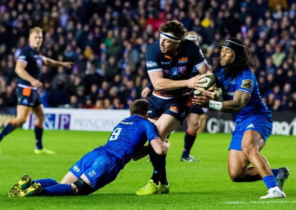 Hamish Watson holds off Leinster pair Luke McGrath and Joe Tomane in Edinburgh's 28-11 win over the Irish side on PRO14 duty. Picture: SNS Group