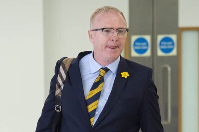 Alex McLeish arrives back at Glasgow Airport after Scotlands trip to Kazakhstan and San Marino. Picture: SNS Group