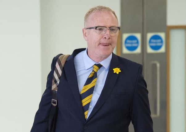 Alex McLeish arrives back at Glasgow Airport after Scotlands trip to Kazakhstan and San Marino. Picture: SNS Group