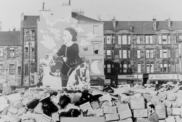Byrne's 'Boy on Dog' mural photographed during the Glasogw bin strikes of the mid 1970s. PIC: Contributed.