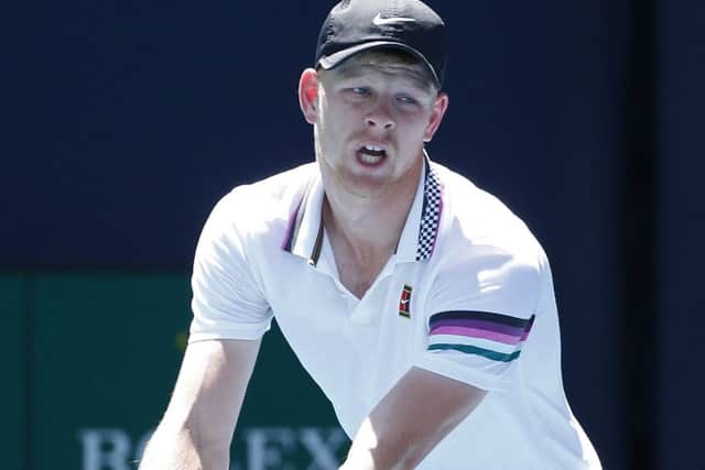 Kyle Edmund prepares to serve to John Isner at the Miami Open. Picture: Joel Auerbach/AP