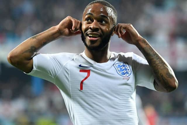 Raheem Sterling responds to chanting from Montenegro fans as he celebrates scoring England's fifth goal. Picture: Michael Regan/Getty