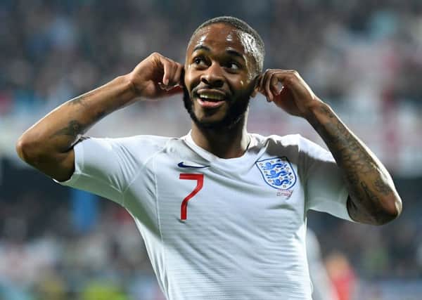 Raheem Sterling responds to chanting from Montenegro fans as he celebrates scoring England's fifth goal. Picture: Michael Regan/Getty