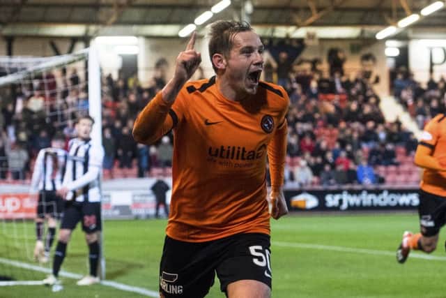 Dundee United goalscorer Peter Pawlett tangles with Dunfermline goalkeeper Ryan Scully at East End Park. Picture: SNs.