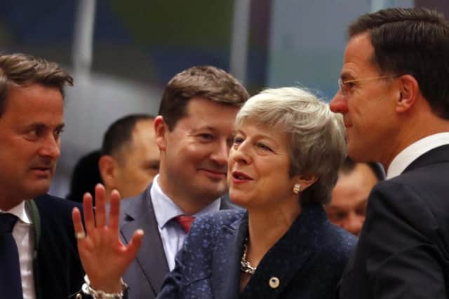 Prime Minister Theresa May speaks with other EU leaders. (AP Photo/Frank Augstein)
