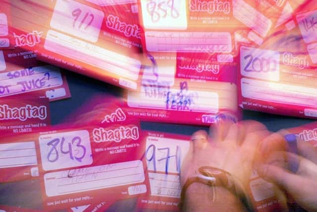At the shagtag board at the nightclub, where clubbers show their feelings to the people they find attractive by writing them messages on the board.