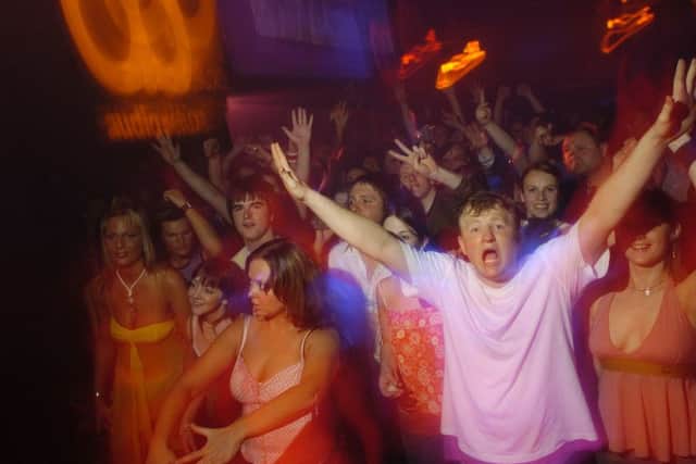 DJs play to an excited crowd at the Honeycomb Club