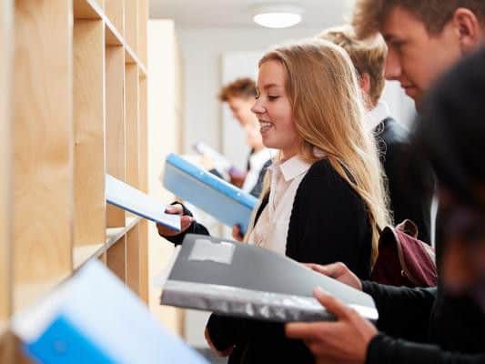 Percentage of school leavers in a work, training, or further education: 100 per cent
