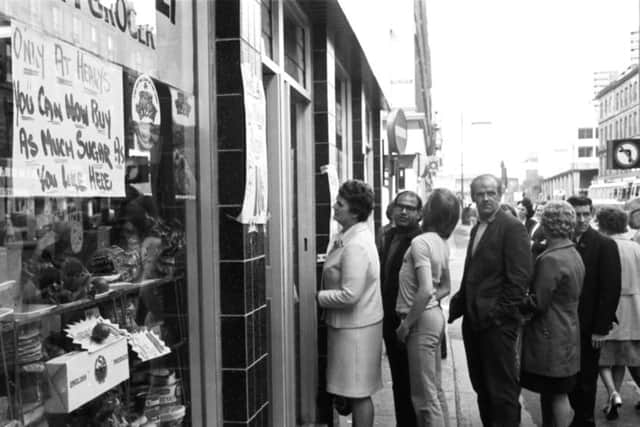 Glasgow shoppers queue at an Argyle Street grocers for sugar, available after the shortage of August 1974.