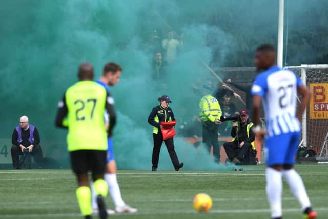 Kilmarnock take on Celtic as stewards deal with smoke bombs. UEFA fines clubs in European competitions through strict liability if their fans use pyrotechnics. Picture: SNS Group