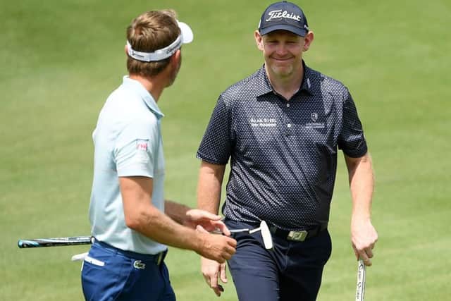Stephen Gallacher smiles after finishing with an eagle-3 in the opening circuit at the DLF Golf & Country Club. Picture: Getty Images