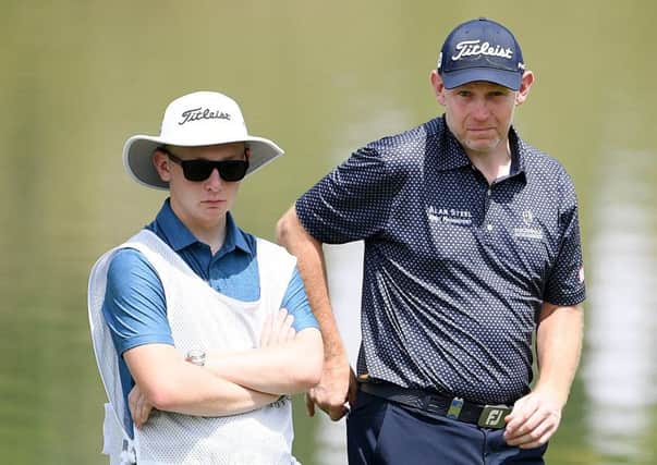 Stephen Gallacher and his caddie, son Jack, during the opening round of the Hero Indian Open in New Delhi, Picture: Getty Images