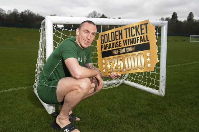 Celtic captain Scott Brown promotes the club's Golden Ticket Paradise Windfall ahead of the Old Firm derby. Picture: Gary Hutchison/SNS