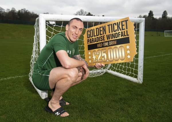 Celtic captain Scott Brown promotes the club's Golden Ticket Paradise Windfall ahead of the Old Firm derby. Picture: Gary Hutchison/SNS