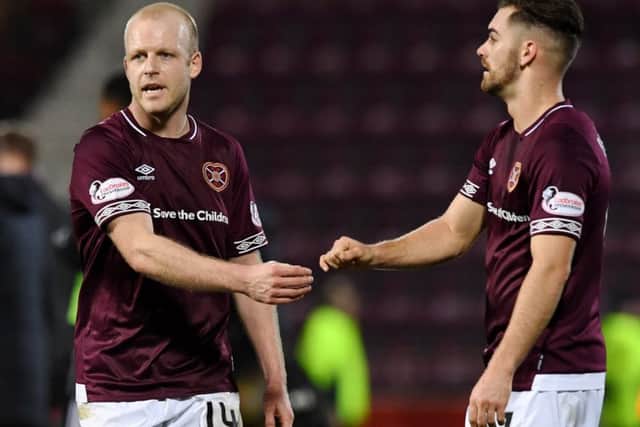 Hearts hope Steven Naismith, left, with sign a new deal but Ben Garuccio, right, is out for 10 month. Picture: SNS