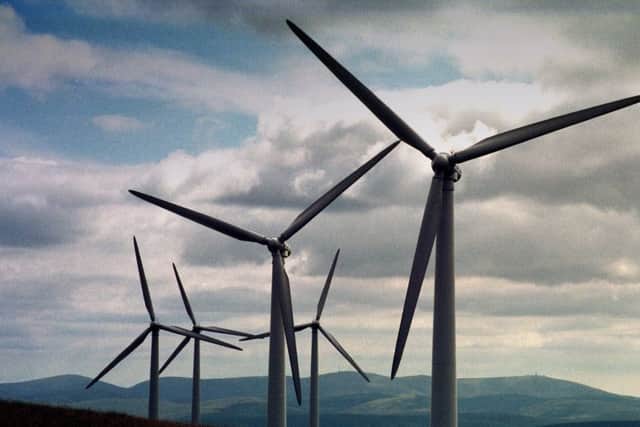 Scotlands windfarms have helped it make world-leading reductions in greenhouse gas emissions (Picture: Alan Milligan)