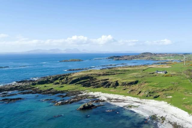 The modern farmhouse has stunning scenery and views of the ocean.