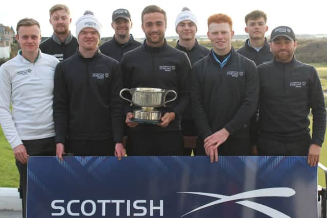 The triumphant Stirling I team show off the Charles McNeill Trophy in Lossiemouth
