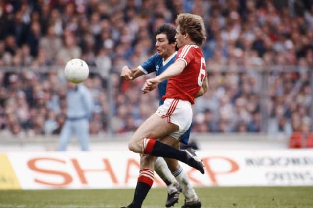 Smith in action for Brighton against Gordon McQueen of Manchester United during the 1983 FA Cup final at Wembley. Picture: Allsport/Getty Images
