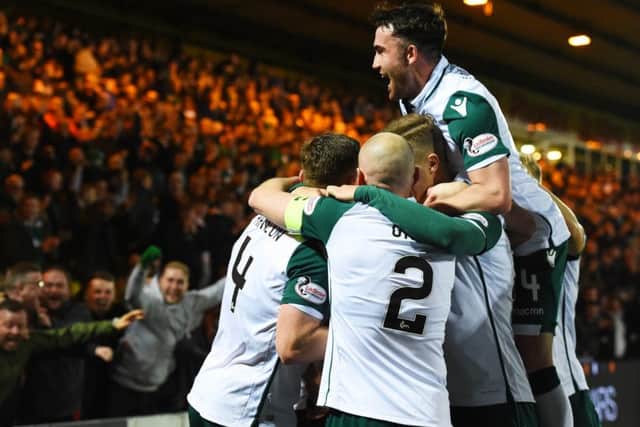 Paul Hanlon celebrates his opener with his Hibs team mates. Picture: SNS Group