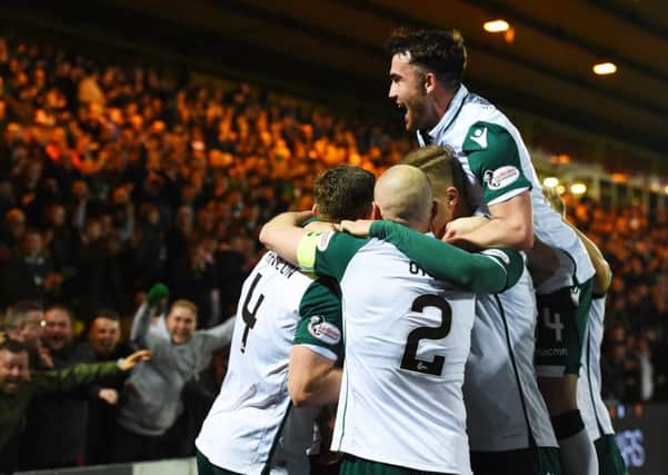 Paul Hanlon celebrates his opener with his Hibs team mates. Picture: SNS Group