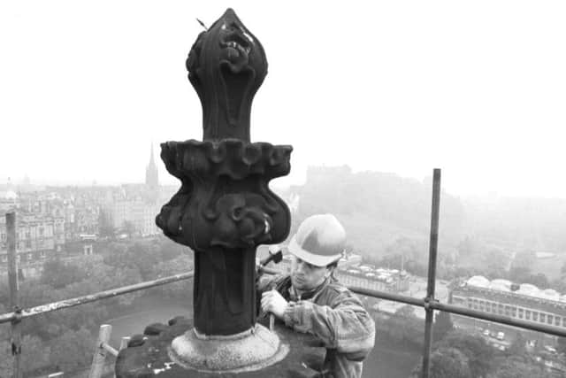 Stone mason Jimmy Gilfillan works on the restoration of the stonework at the very top of the Scott Monument in Edinburgh, October 1988.