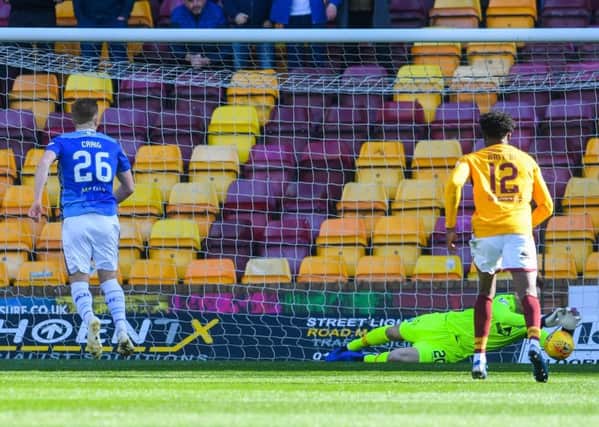 Motherwell goalkeeper Mark Gillespie saves Liam Craig's first-half penalty. Picture: SNS
