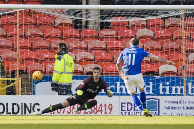 Stephen Dobbie sends Benjamin Siegrist in the United goal the wrong way from the penalty spot. Photograph: Kenny Smith/SNS