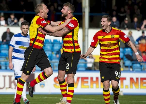 Steven Anderson, left, wheels away to celebrate after scoring for Partick Thistle. Picture: SNS