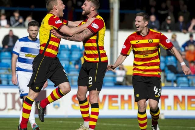 Steven Anderson, left, wheels away to celebrate after scoring for Partick Thistle. Picture: SNS