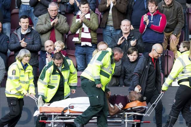 Uche Ikpeazu was stretchered off late in the 2-1 win over Aberdeen. Picture: SNS