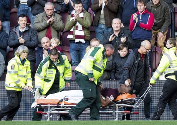 Uche Ikpeazu was stretchered off late in the 2-1 win over Aberdeen. Picture: SNS