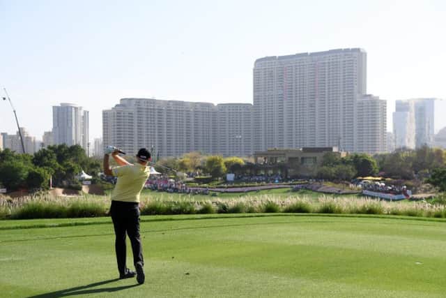 Stephen Gallacher hits his title-winning shot into the par-5 18th at DLF Golf & Country Club. Picture: Getty Images