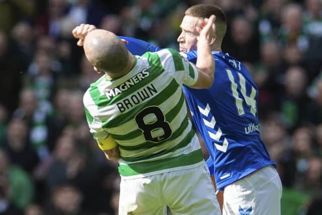 Ryan Kent strikes out at Celtic captain Scott Brown. Picture: SNS