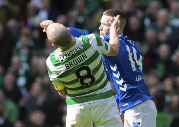 Ryan Kent strikes out at Celtic captain Scott Brown. Picture: SNS
