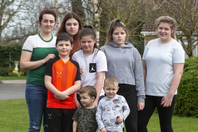 *
L-R Shannon Ellis, 23, Blaine Ellis, 8, Mia Ellis, 16, Keevie Ellis, 10, Rowan Ferguson, 2, Harrison Ferguson, 3, Bracken Ellis, 12, and Neve Ellis, 15. Picture: SWNS