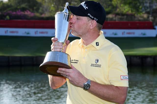 Stephen Gallacher kisses the trophy following his victory in the Hero Indian Open. Picture: Getty