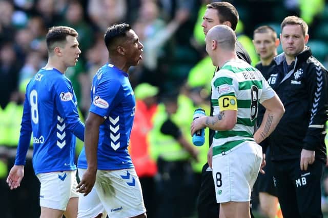 Alfredo Morelos walks off the Celtic Park pitch after being given a red card. Picture: Getty