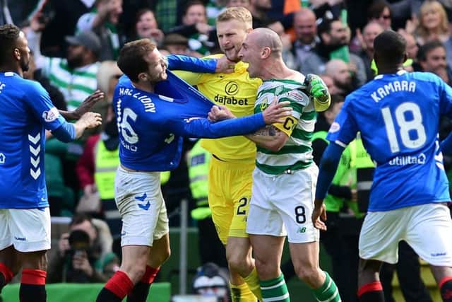 Scott Brown and Andy Halliday come to blows at full-time following Celtic's 2-1 win over Rangers. Picture: Mark Runnacles/Getty Images